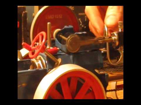 model steam tractor powered by Sterno and turning 12V motor as a generator